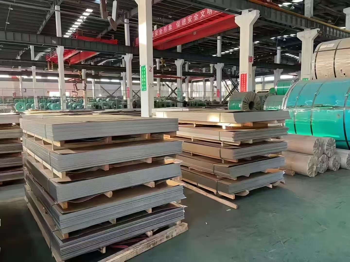 Stainless steel plate stock in a factory warehouse
